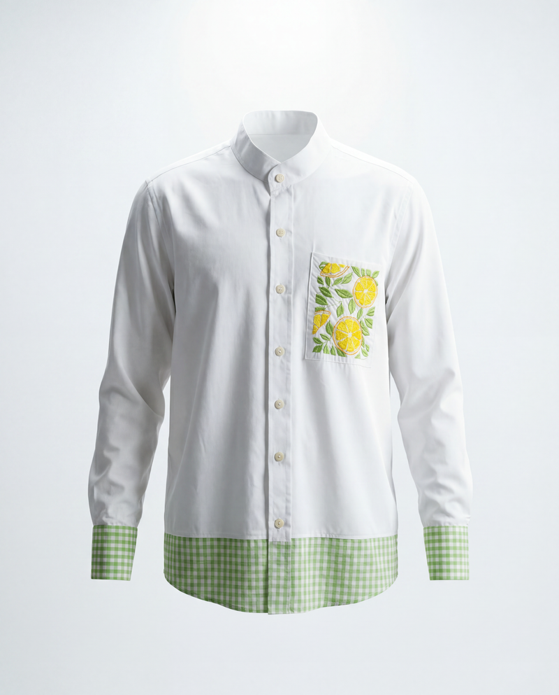 White shirt with floral embroidery and green checkered details on a white background